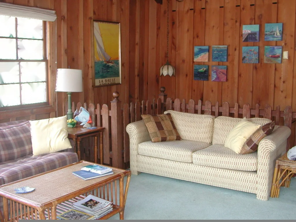 This warm friendly beach house is decorated in family antiques and beach memorabilia and art.